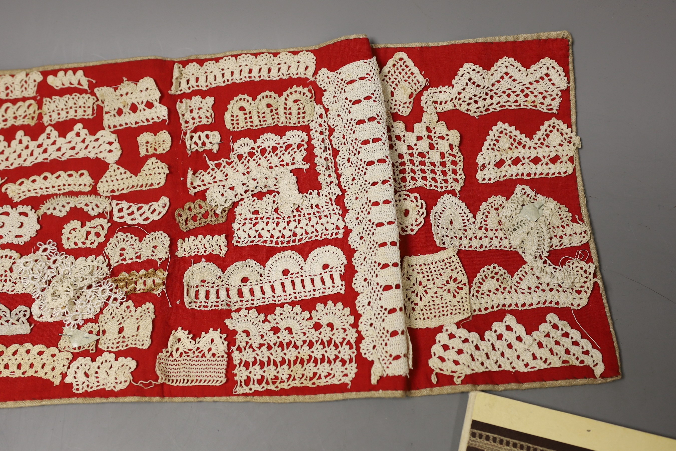 A collection of different crochet worked motifs and panels together with the DMC Library crochet work book